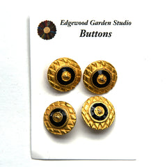 Gold shield buttons with black and gold center, on card