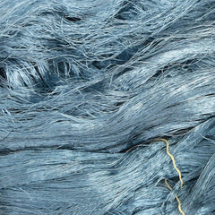 Closeup of Japanese silk embroidery thread, in blue