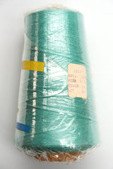 Lily 20/2 cotton yarn on a cone, wrapped in plastic - side view