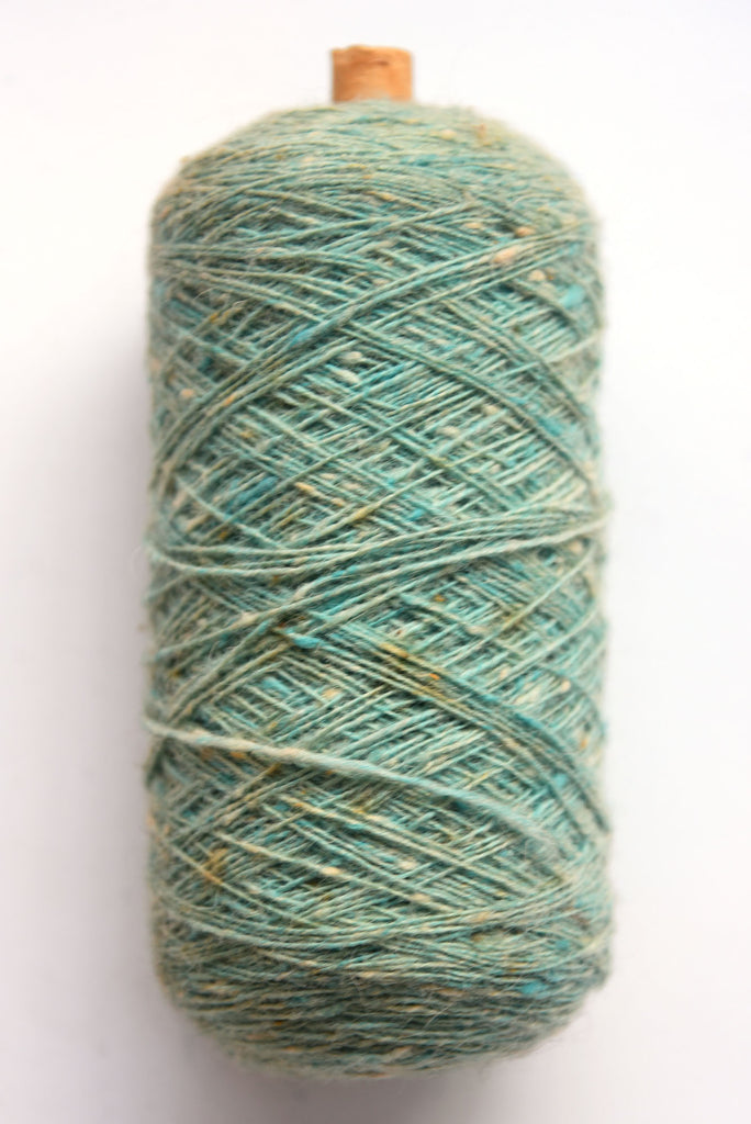 Scottish wool weaving yarn on tubes - side view