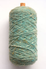 Scottish wool weaving yarn on tubes - side view
