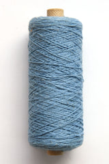 Cotton 10/2 slu-spun weaving yarn on a tube - side view