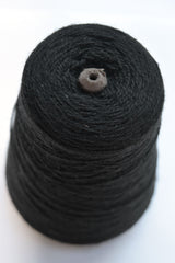 Unlabeled black wool yarn cone  top view